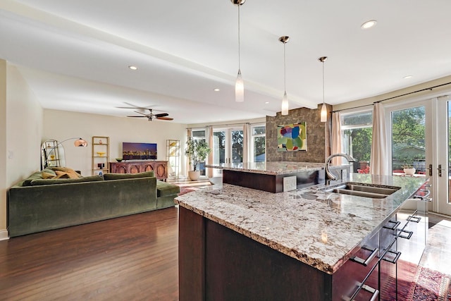 5843 N Oconto Ave, Chicago, IL 60631 - kitchen featuring a sink, a center island with sink, dark wood finished floors, recessed lighting, and open floor plan