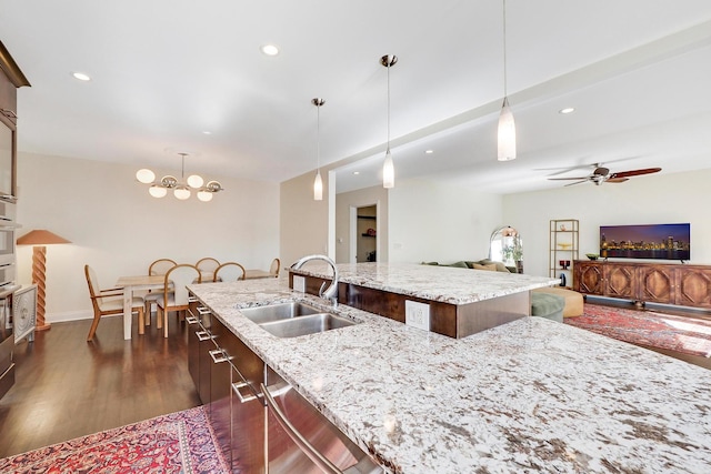 5843 N Oconto Ave, Chicago, IL 60631 - kitchen featuring a sink, a chandelier, dark wood-type flooring, a center island with sink, and recessed lighting