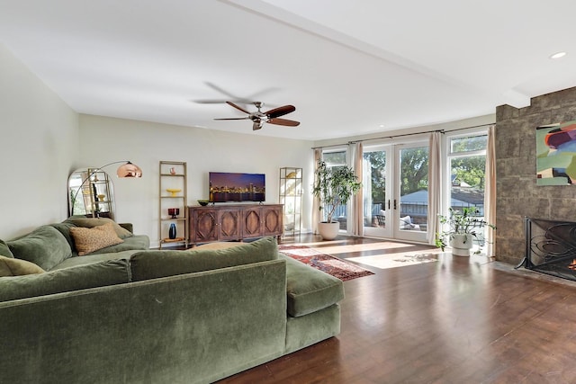 5843 N Oconto Ave, Chicago, IL 60631 - living room with wood finished floors, a ceiling fan, a fireplace, and french doors