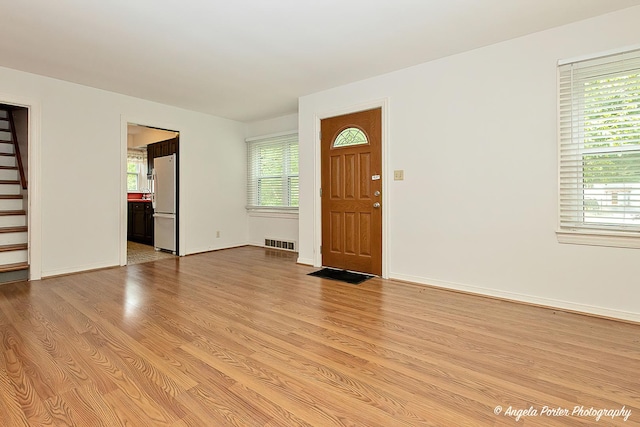 2618 Kashmiri Ave, Mchenry, IL 60050 - entrance foyer with light wood-type flooring, stairway, and baseboards