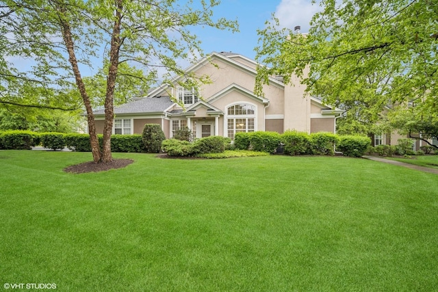 3047 Lexington Ln, Glenview, IL 60026 - traditional-style house with stucco siding and a front lawn