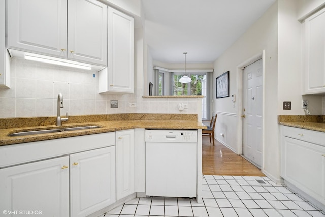3047 Lexington Ln, Glenview, IL 60026 - kitchen featuring dishwasher, a sink, white cabinetry, tasteful backsplash, and light tile patterned flooring