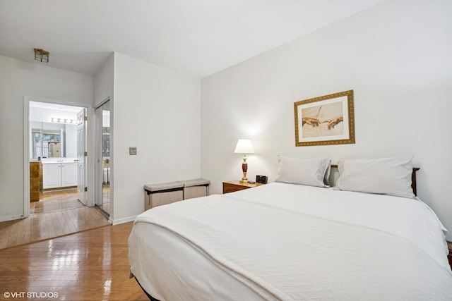 3047 Lexington Ln, Glenview, IL 60026 - bedroom featuring light wood-style floors, baseboards, and ensuite bath
