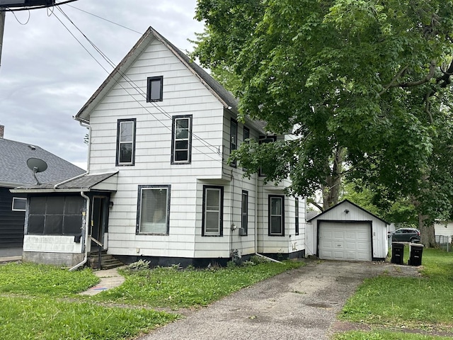 107 W S St, Morrison, IL 61270 - traditional home featuring an outbuilding, asphalt driveway, entry steps, and a garage