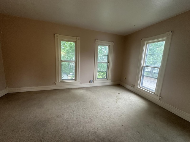 107 W S St, Morrison, IL 61270 - spare room featuring carpet flooring and baseboards