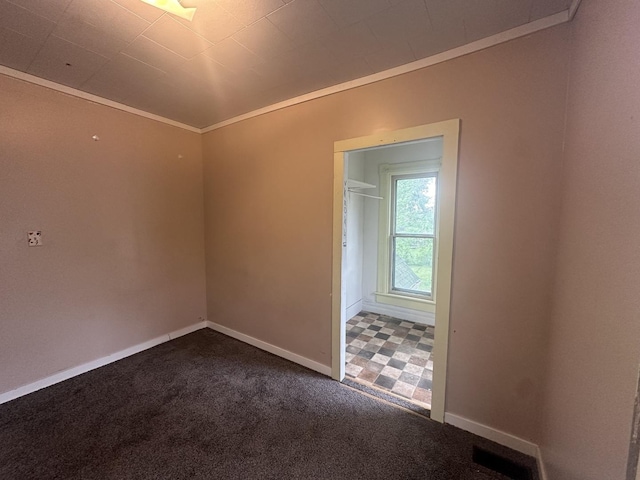 107 W S St, Morrison, IL 61270 - spare room with ornamental molding, baseboards, and carpet flooring