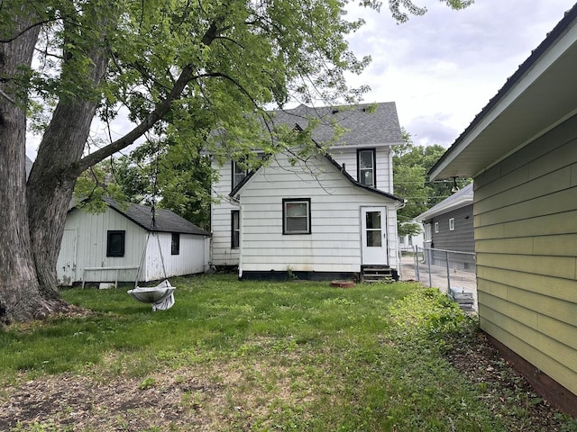 107 W S St, Morrison, IL 61270 - back of property featuring entry steps and a shingled roof