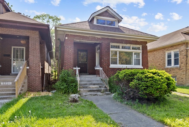 7703 S Loomis Blvd, Chicago, IL 60620 - property entrance featuring brick siding and a shingled roof