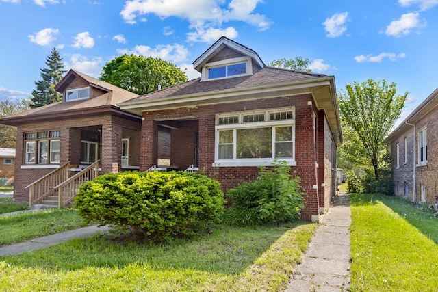 7703 S Loomis Blvd, Chicago, IL 60620 - bungalow-style house with brick siding and a front lawn