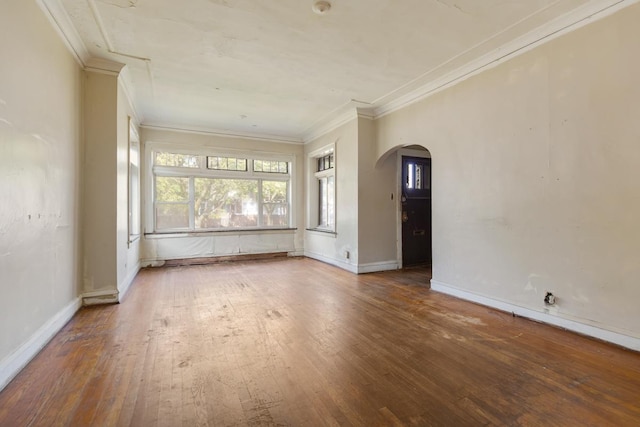 7703 S Loomis Blvd, Chicago, IL 60620 - spare room with arched walkways, hardwood / wood-style flooring, crown molding, and baseboards