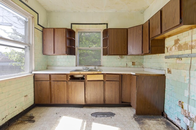 7703 S Loomis Blvd, Chicago, IL 60620 - kitchen with open shelves, light countertops, and brown cabinets