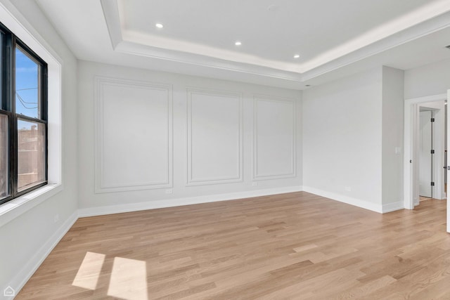 3905 N Drake Ave, Chicago, IL 60618 - empty room with a raised ceiling, light wood finished floors, recessed lighting, and baseboards