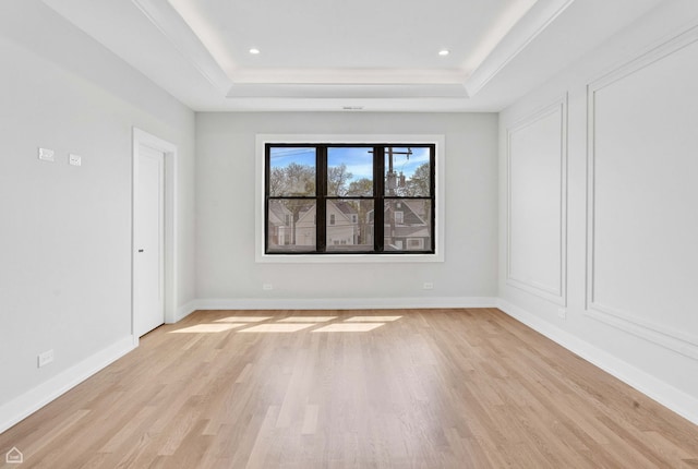 3905 N Drake Ave, Chicago, IL 60618 - empty room with a tray ceiling, light wood finished floors, baseboards, and recessed lighting