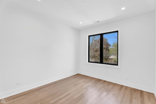 3905 N Drake Ave, Chicago, IL 60618 - spare room with light wood-style flooring, baseboards, and recessed lighting