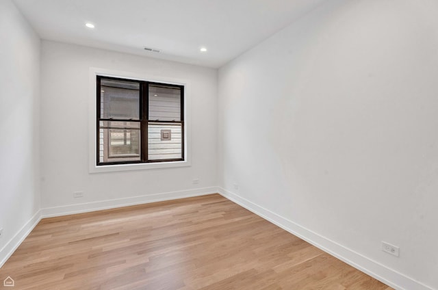 3905 N Drake Ave, Chicago, IL 60618 - unfurnished room featuring light wood finished floors, baseboards, and recessed lighting