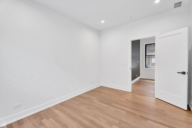 3905 N Drake Ave, Chicago, IL 60618 - empty room with baseboards, light wood finished floors, and recessed lighting
