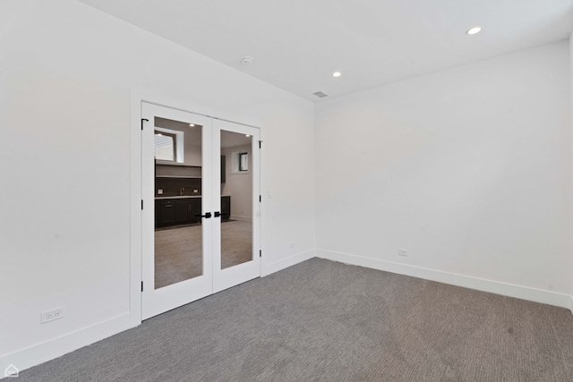 3905 N Drake Ave, Chicago, IL 60618 - carpeted spare room with french doors, baseboards, and recessed lighting