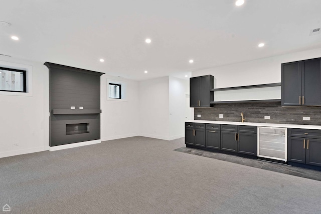 3905 N Drake Ave, Chicago, IL 60618 - kitchen featuring open shelves, wine cooler, baseboards, a fireplace, and recessed lighting
