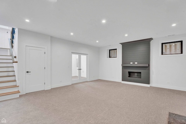 3905 N Drake Ave, Chicago, IL 60618 - unfurnished living room featuring recessed lighting, stairway, baseboards, light carpet, and a fireplace