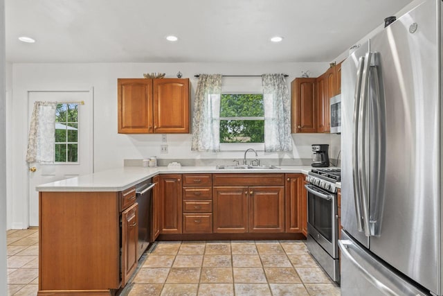 2N439 Bernice Ave, Glen Ellyn, IL 60137 - kitchen featuring stainless steel appliances, a sink, a peninsula, light countertops, and recessed lighting