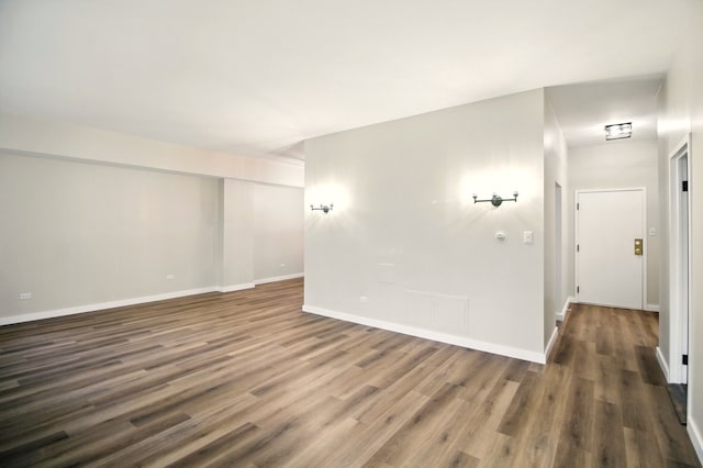 9009 Golf Rd Unit 1C, Des Plaines, IL 60016 - empty room featuring wood finished floors and baseboards