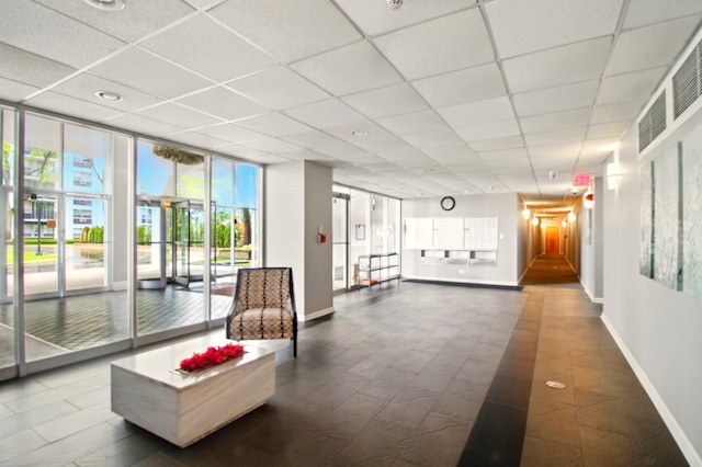 9009 Golf Rd Unit 1C, Des Plaines, IL 60016 - building lobby with a paneled ceiling and a wall of windows