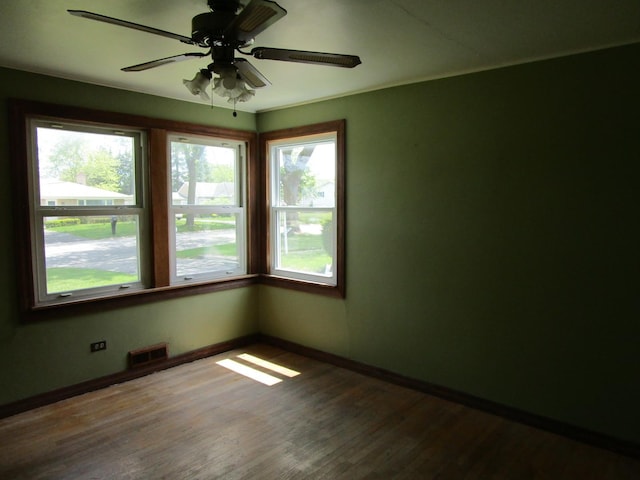 786 N Van Auken St, Elmhurst, IL 60126 - spare room with plenty of natural light, baseboards, wood finished floors, and a ceiling fan