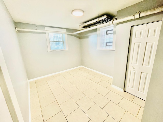 2300 W Granville Ave Unit G, Chicago, IL 60659 - below grade area featuring light tile patterned flooring and baseboards