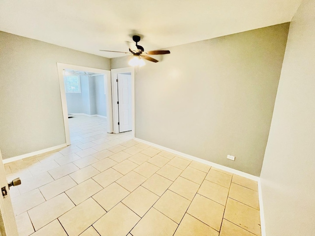 2300 W Granville Ave Unit G, Chicago, IL 60659 - spare room featuring ceiling fan, light tile patterned flooring, and baseboards