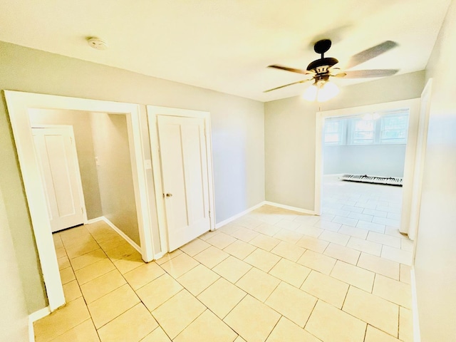2300 W Granville Ave Unit G, Chicago, IL 60659 - spare room with a ceiling fan, light tile patterned floors, a smoke detector, and baseboards