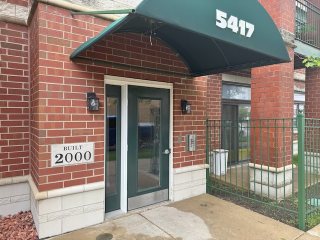 5417 S Melvina Ave Unit 203, Chicago, IL 60638 - view of exterior entry featuring brick siding
