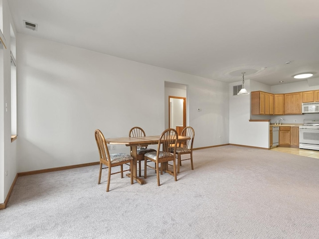 5417 S Melvina Ave Unit 203, Chicago, IL 60638 - dining area featuring baseboards and light carpet