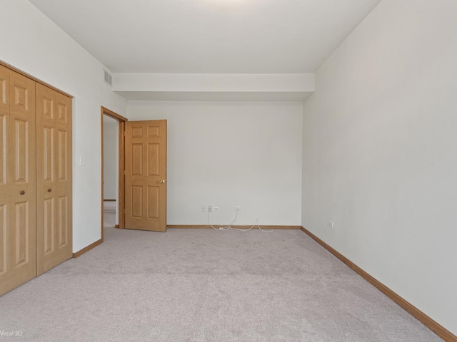 5417 S Melvina Ave Unit 203, Chicago, IL 60638 - unfurnished bedroom featuring carpet flooring, baseboards, and a closet