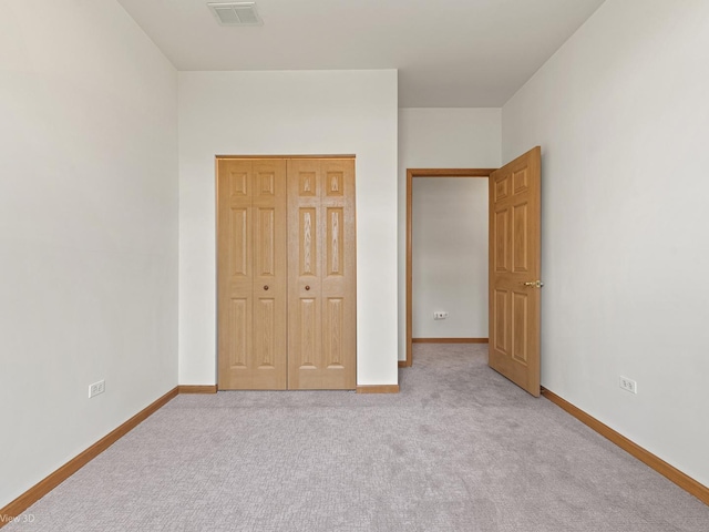 5417 S Melvina Ave Unit 203, Chicago, IL 60638 - unfurnished bedroom featuring carpet floors, baseboards, and a closet
