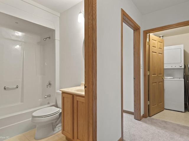 5417 S Melvina Ave Unit 203, Chicago, IL 60638 - bathroom with stacked washer / dryer, vanity, tub / shower combination, toilet, and tile patterned flooring
