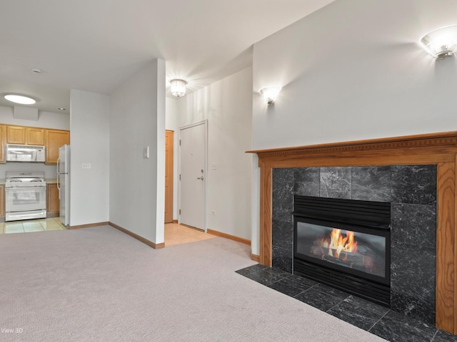 5417 S Melvina Ave Unit 203, Chicago, IL 60638 - unfurnished living room featuring a high end fireplace, light carpet, and baseboards