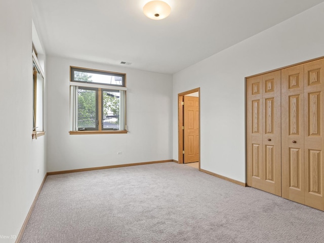 5417 S Melvina Ave Unit 203, Chicago, IL 60638 - unfurnished bedroom featuring carpet floors, baseboards, and a closet