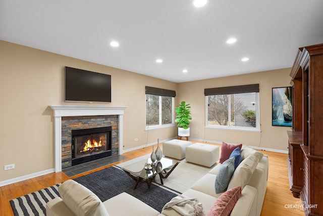 2539 Lexington Ln, Naperville, IL 60540 - living area featuring light wood-style floors, healthy amount of natural light, a stone fireplace, baseboards, and recessed lighting