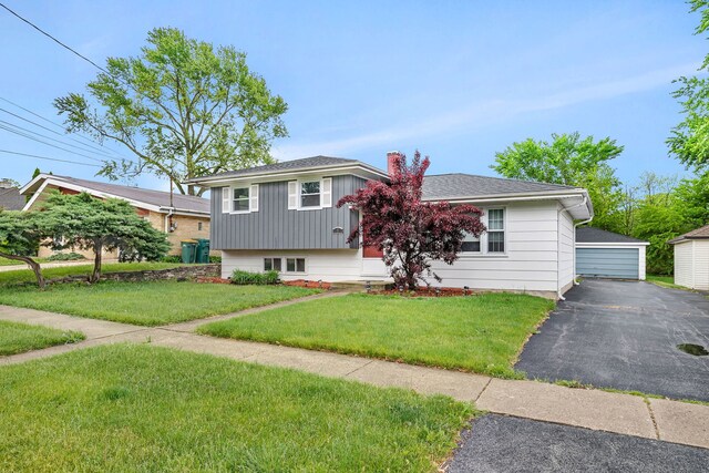 8 E Eureka St, Lemont, IL 60439 - tri-level home featuring a front lawn, a detached garage, and an outbuilding