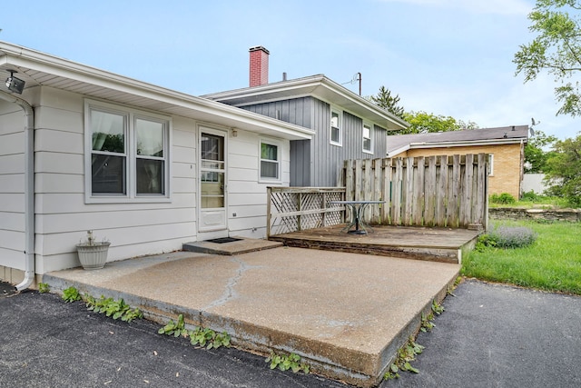 8 E Eureka St, Lemont, IL 60439 - rear view of property featuring a chimney, a deck, and a patio area