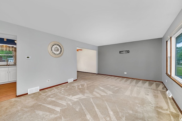8 E Eureka St, Lemont, IL 60439 - carpeted spare room featuring baseboards and a sink