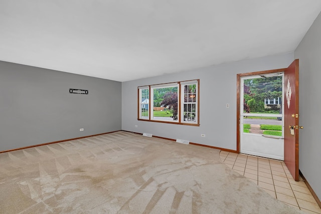 8 E Eureka St, Lemont, IL 60439 - carpeted empty room with plenty of natural light and baseboards