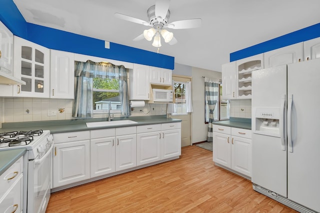 8 E Eureka St, Lemont, IL 60439 - kitchen with white appliances, a sink, a ceiling fan, decorative backsplash, and glass insert cabinets