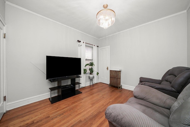 5331 W Schubert Ave, Chicago, IL 60639 - living room with a chandelier, wood finished floors, and crown molding