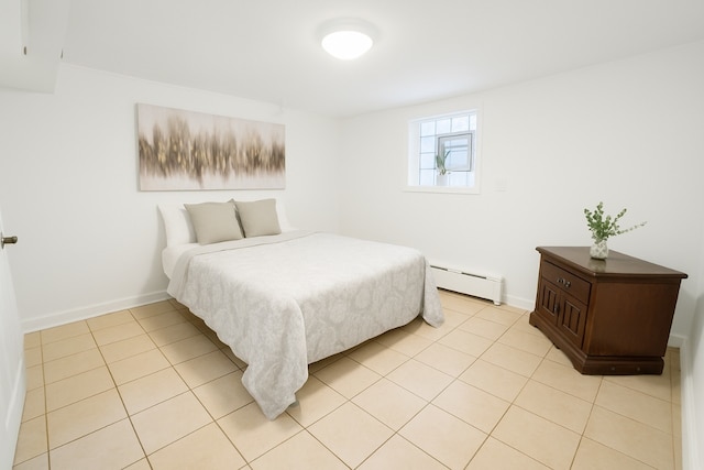 5331 W Schubert Ave, Chicago, IL 60639 - bedroom featuring baseboard heating and light tile patterned flooring
