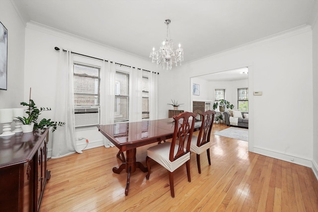 5331 W Schubert Ave, Chicago, IL 60639 - dining space featuring a chandelier, light wood-type flooring, crown molding, and cooling unit