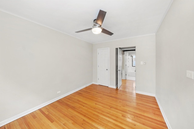 213 N Marion St Unit 1C, Oak Park, IL 60302 - unfurnished room featuring ornamental molding, ceiling fan, baseboards, and light wood-type flooring