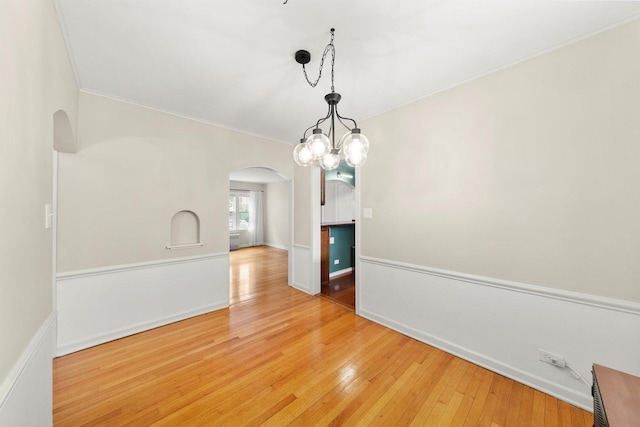 213 N Marion St Unit 1C, Oak Park, IL 60302 - empty room with arched walkways, wood-type flooring, ornamental molding, and baseboards