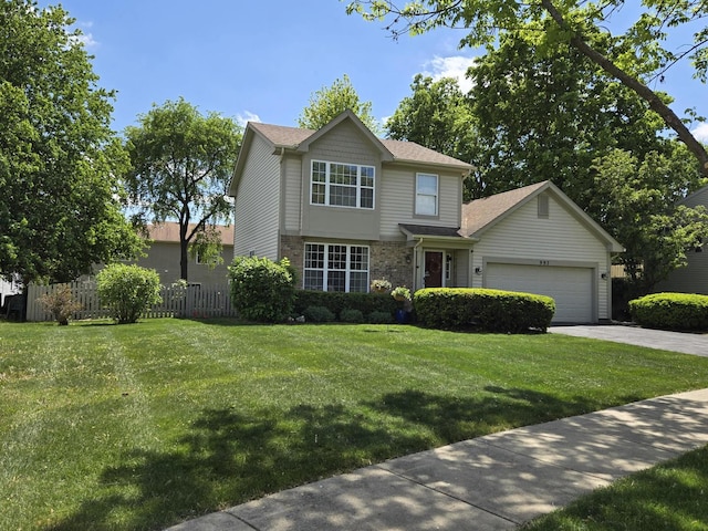 997 W Briarcliff Rd, Bolingbrook, IL 60440 - traditional-style house with an attached garage, driveway, and a shingled roof