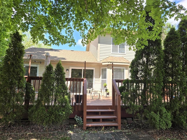 997 W Briarcliff Rd, Bolingbrook, IL 60440 - rear view of property featuring a deck and roof with shingles